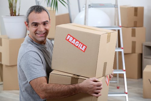 Removal team supporting a home move in Lee with packed boxes and furniture