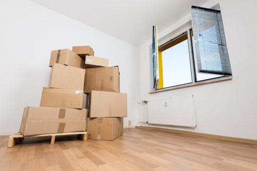 Packed boxes and removal van ready for a local move in Lee