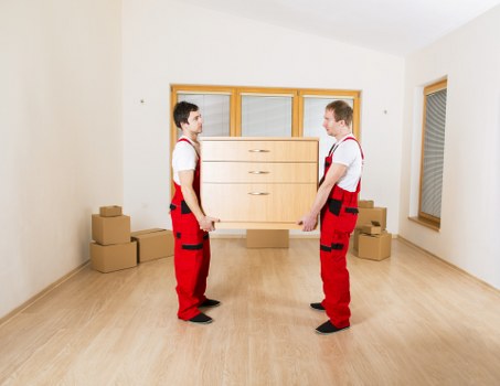 Packed boxes and protective materials prepared for a local move in Lee