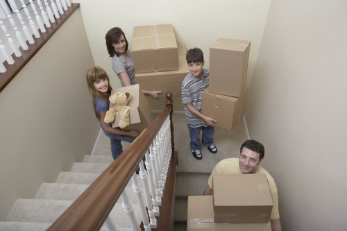 Local movers carrying furniture for a commercial relocation in Lee